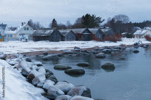 Icy coast with frozen boulders. Fishers' village Kasmu, Estonia.