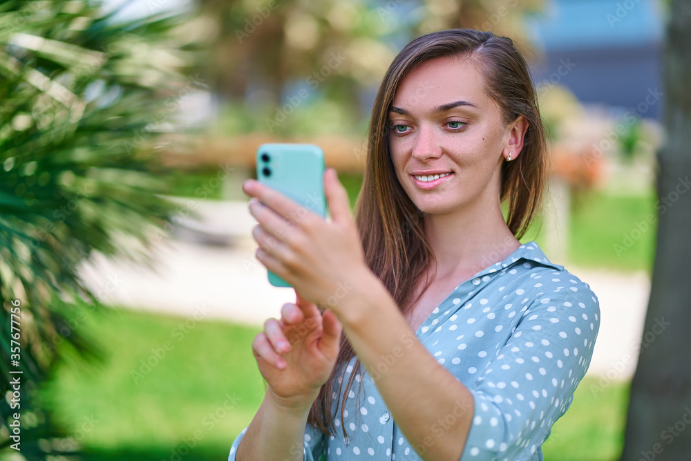Young woman uses smartphone outdoors. Modern people with digital mobility lifestyle Young woman uses smartphone outdoors. Modern people with digital mobility lifestyle