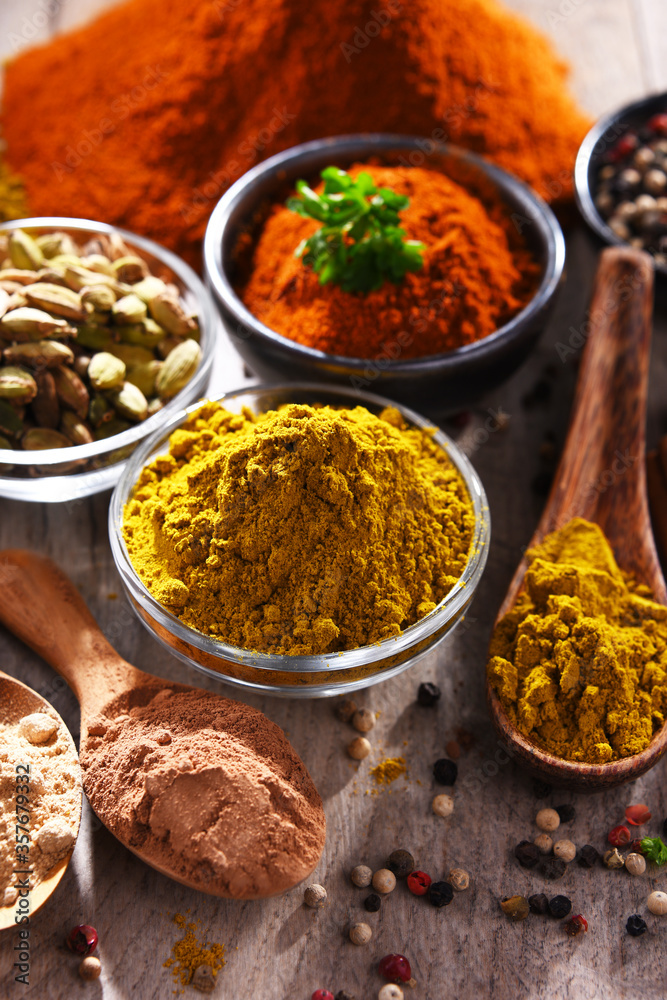 Variety of spices on kitchen table Variety of spices on kitchen table