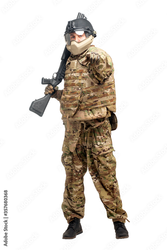 American commando in uniform with a shotgun on a white background, portrait of a soldier with a weapon