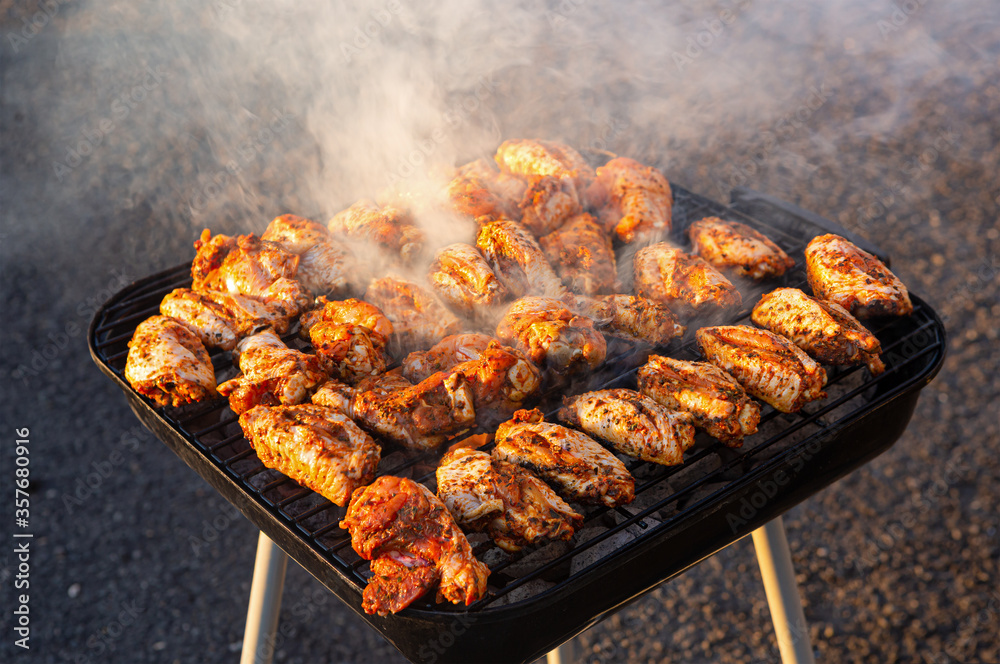 Halal Seasoned Chicken Cooking on a Charcoal Grill Halal Seasoned Chicken Cooking on a Charcoal Grill