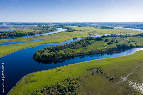 Scenic aerial view of a river and green fields in a countryside © Ravil Sayfullin