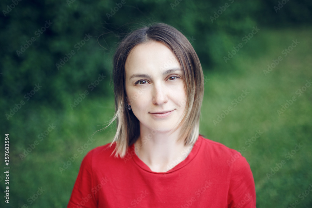 Portrait head shot of beautiful pensive Caucasian middle age woman with  long light bob hair. Casual