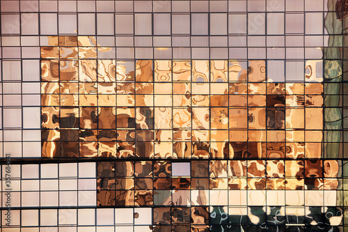 Canvas Print Buildings reflected in the windows of a modern office building in Dubai