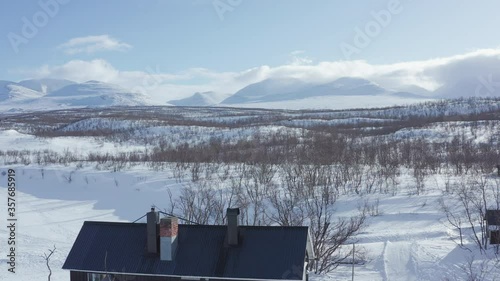 Abisko National Park. Drone crane shot at the shore of Torneträsk Lake.