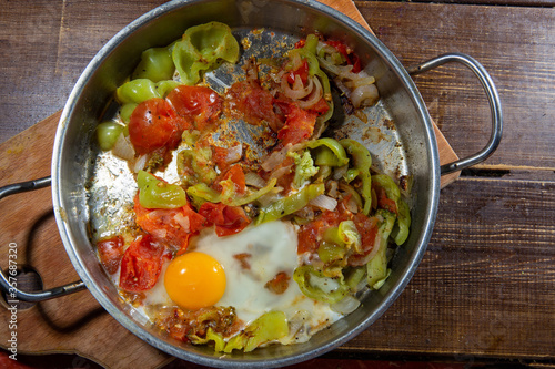 Stewed vegetables and  egg on pan