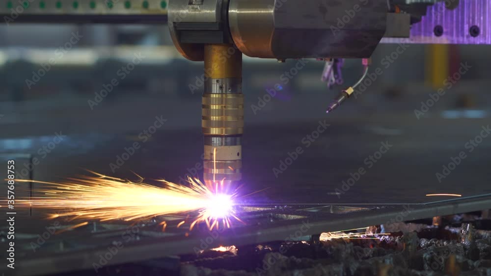 Plasma cutting machine cuts metal material with sparks