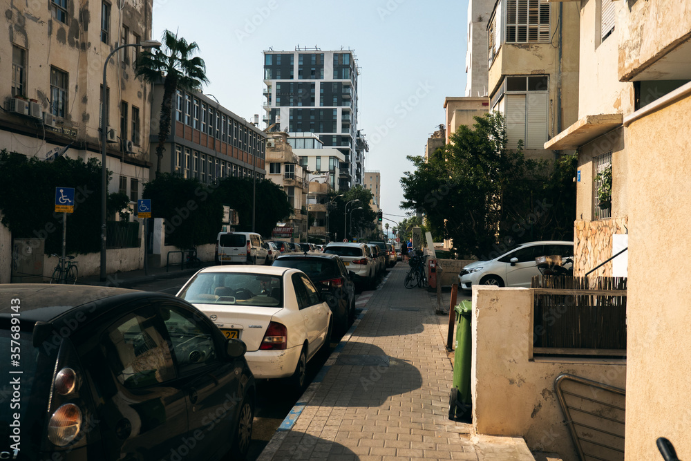 Cars parked on the street, city of Tel Aviv Israel.