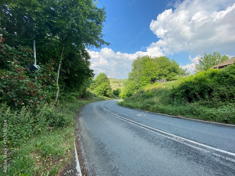 Country lane with trees and grass, leading to Denholme near, Thornton, Bradford, UK