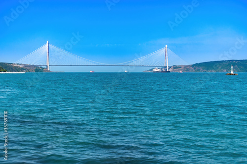 Yavuz Sultan Selim bridge view from distance and cargo ships