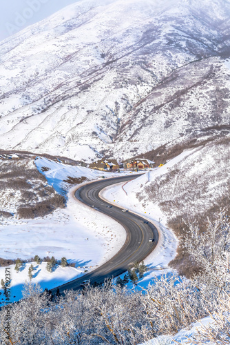 Wasatch Mountain landscape with road and houses on snowy residential community