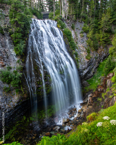 Fototapeta Naklejka Na Ścianę i Meble -  Large waterfall cascading down in the mountains.  Mount Rainier National Park