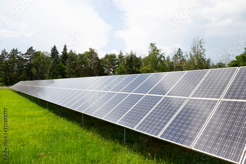 Solar Power Station on the spring flowering Meadow 