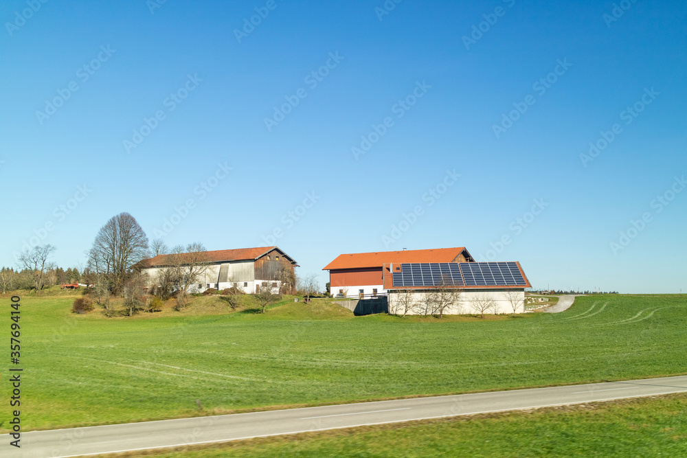 Farming land with buildings on a green fields and areas, Austria. Farming land with buildings on a green fields and areas, Austria.