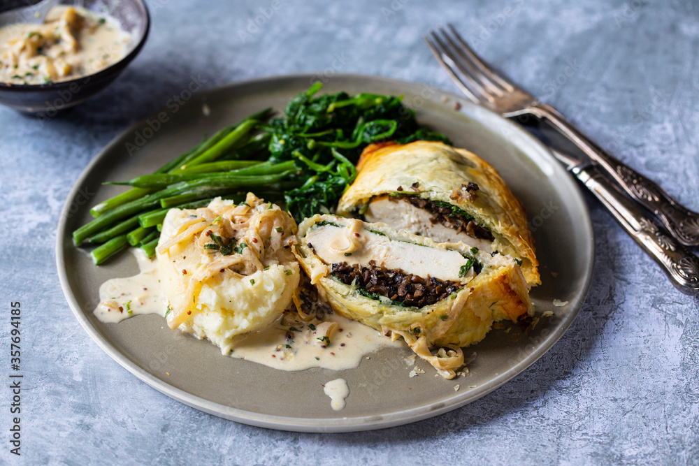 Chicken Wellington with creamy mustard sauce, spinach and green beans Chicken Wellington with creamy mustard sauce, spinach and green beans