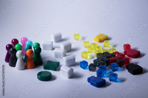 Elements - attributes for board games - figures cubes bottles houses. On white background. Isolated. Copy space.