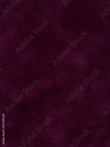 Abstract maroon velvet background for text or logo placement. Red Velvet Background with copy space.Red Textured Paper. Top view of stylish dark red velvet textile as background.
