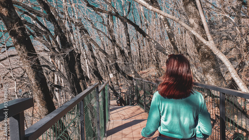 Girl on a walk on the skypark suspension bridge in Sochi