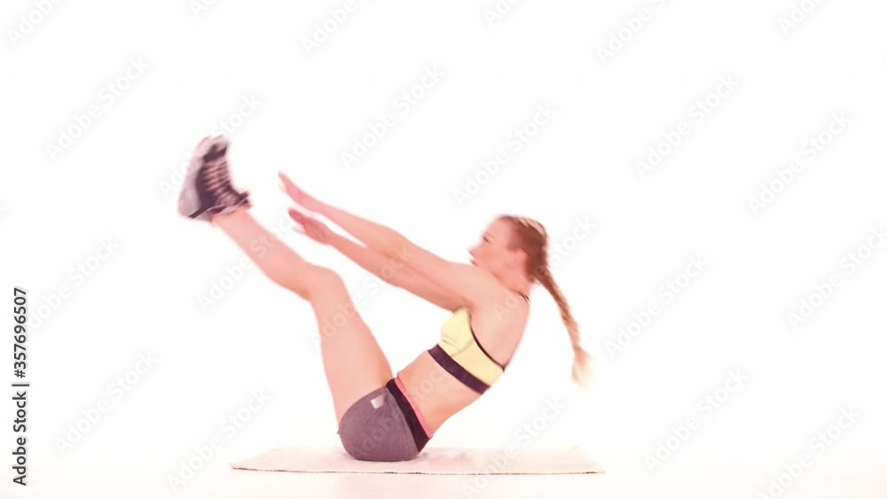 Trainer fitness girl doing V crunch side view. Sports video tutorials isolated on white. Health care concept. Sports concept. tinted footage. Prores 422. Trainer fitness girl doing V crunch side view. Sports video tutorials isolated on white. Health care concept. Sports concept. tinted footage. Prores 422.