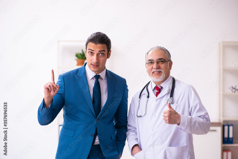 Young businessman meeting with old doctor Young businessman meeting with old doctor