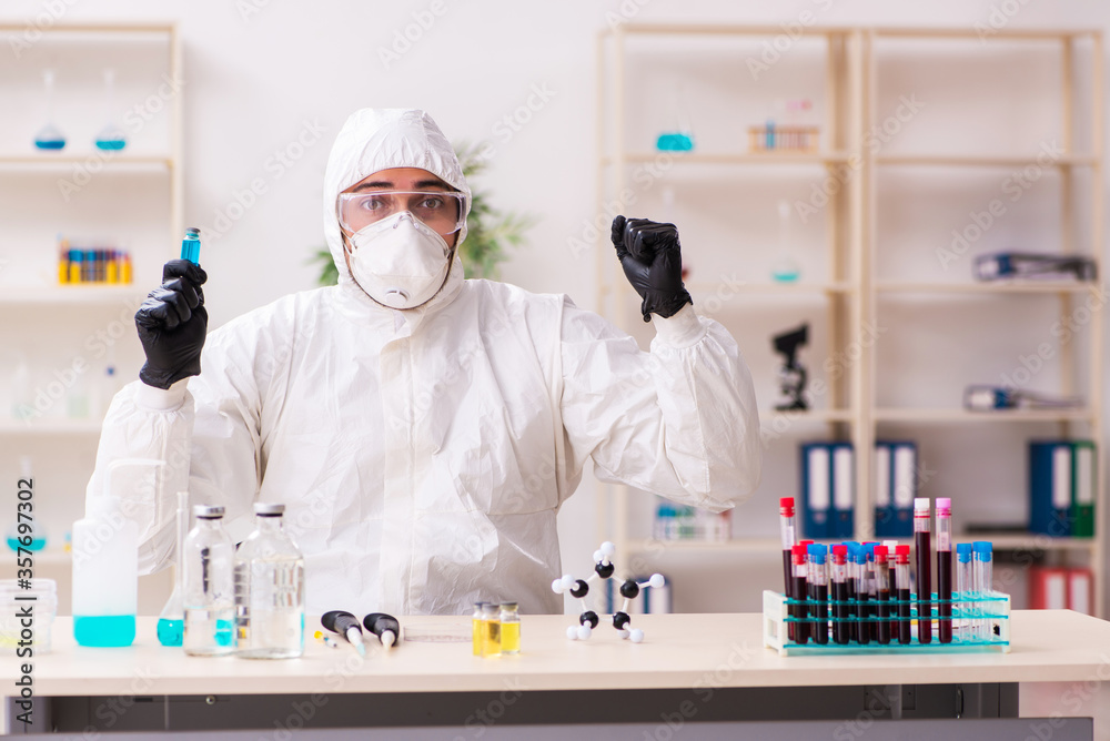 Doctor working in lab in coronavirus COVID-19 concept