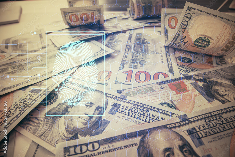 Double exposure of finger print scan drawing over usa dollars bill background. Concept of security of safe access.