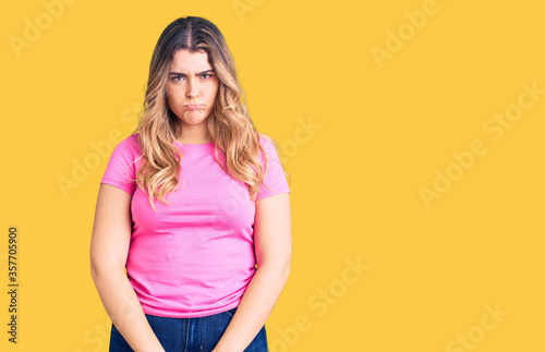 Young caucasian woman wearing sportswear depressed and worry for distress, crying angry and afraid. sad expression.