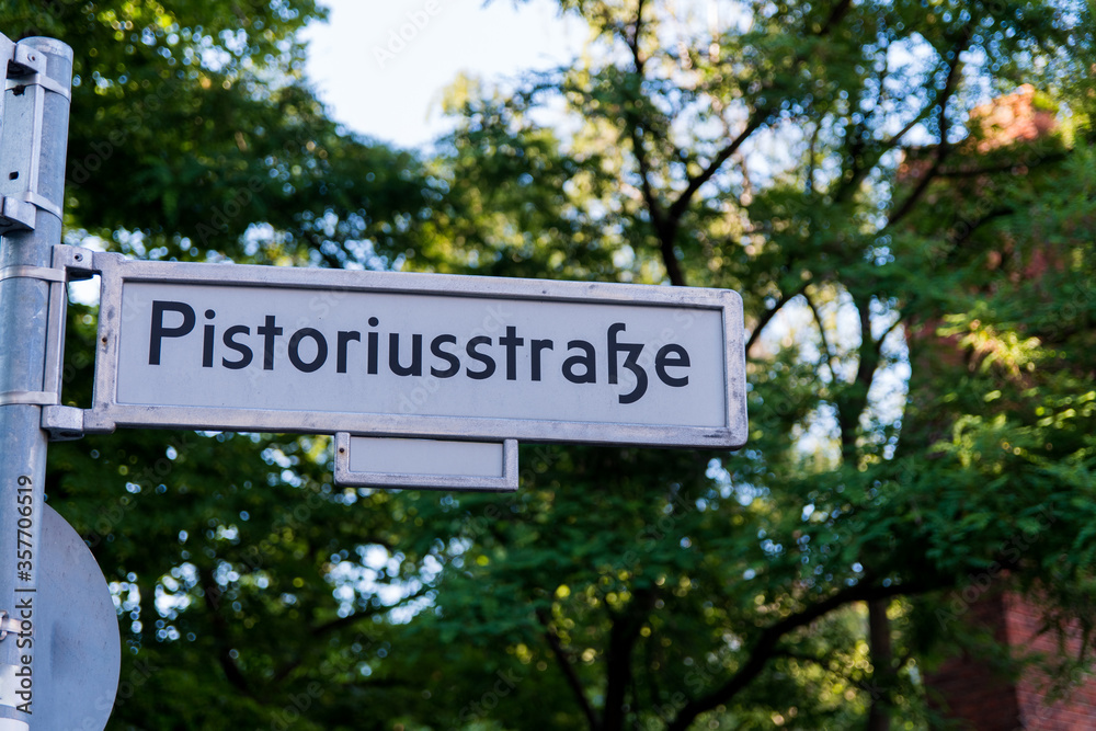 Fototapeta premium Low angle view of street sign in Weissensee, East Berlin, Germany