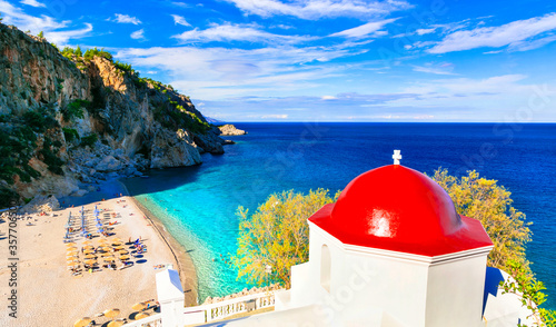 Fototapeta Naklejka Na Ścianę i Meble -  most beautiful beaches of Greece, Karpathos island - Kyra Panagia with turquoise sea and red church.