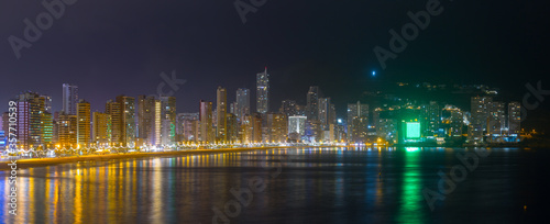Breathtaking panoramic view of summer resort with beach and famous skyscrapers. Beautiful evening lights of big city. Costa Blanca. City of Benidorm, Alicante, Valencia, Spain.
