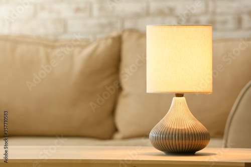 Modern lamp on table in room