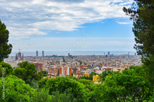 Photos Panoramic view of Barcelona cityscape framed with greenery and trees: plenty of