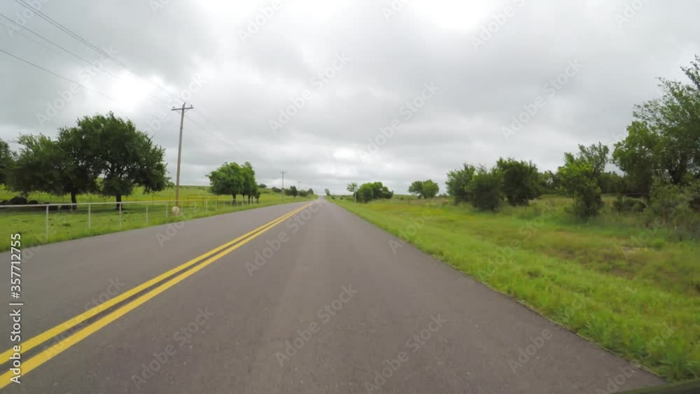 Oklahoma, countryside. POV. Point of view countryside in the spring. Scenic view from car of beautiful green fields, trees. Oklahoma, countryside. POV. Point of view countryside in the spring. Scenic view from car of beautiful green fields, trees.