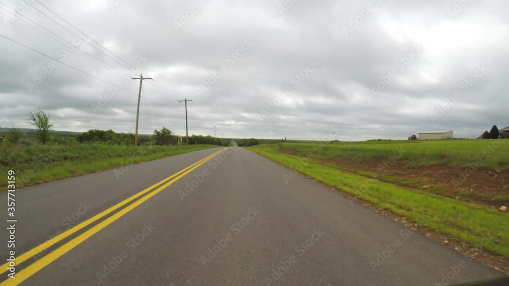 Oklahoma, countryside. POV. Point of view countryside in the spring. Scenic view from car of beautiful green fields, trees. Oklahoma, countryside. POV. Point of view countryside in the spring. Scenic view from car of beautiful green fields, trees.