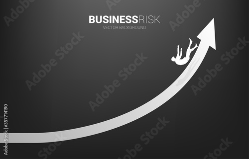 silhouette of businessman slip and falling down from growing arrow. Concept for fail and accidental business