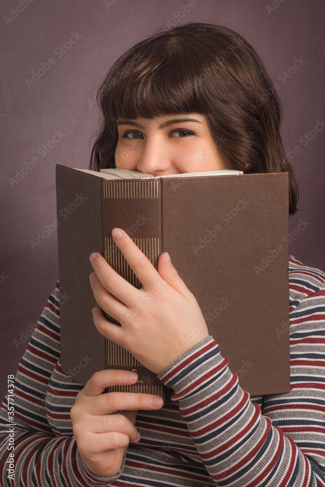 Female model holding a book Female model holding a book