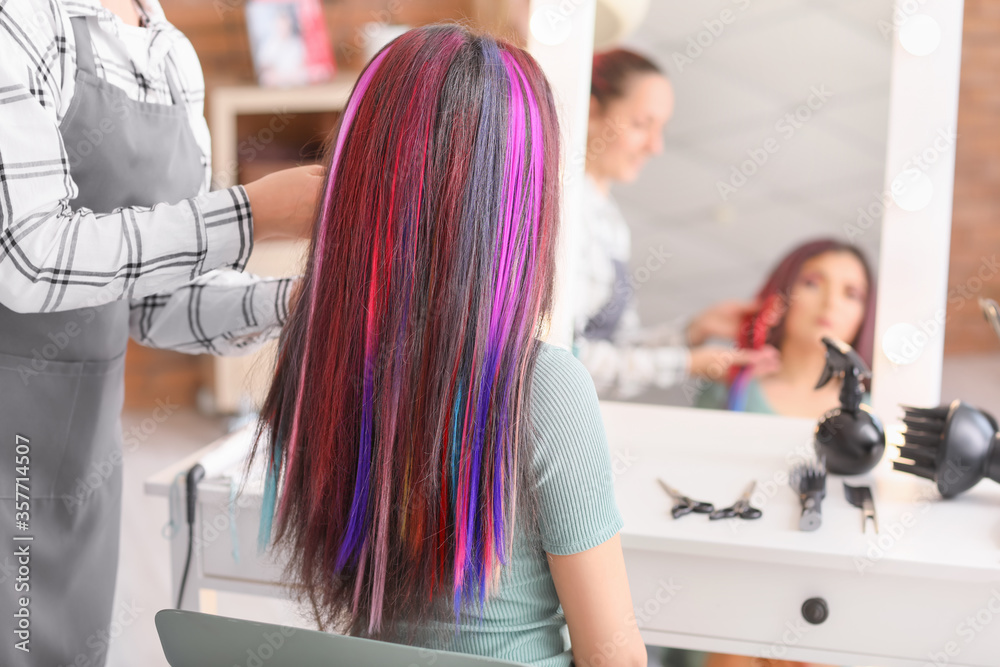 Hairdresser working with young woman in beauty salon Hairdresser working with young woman in beauty salon
