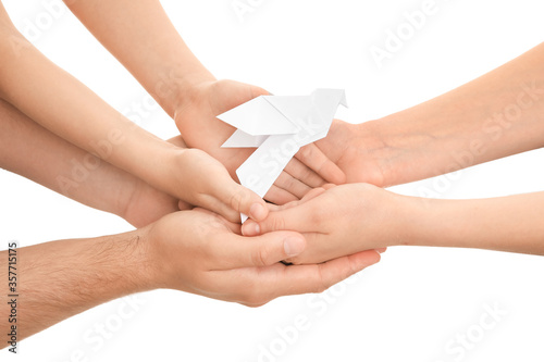 Hands of family with paper ...