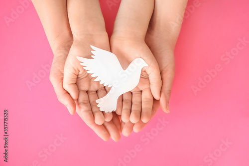 Hands of family with paper ...