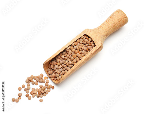 Scoop with lentils on white background