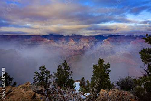 Mist flows through the Grand Canyon as seen from Mather Point of the South Rim of Grand Canyon National Park.