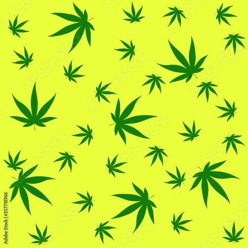 green marijuana leafs falling on yellow fund