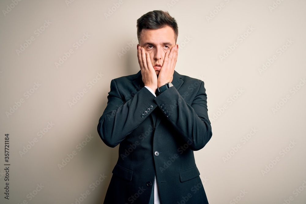 Young handsome business man wearing elegant suit and tie over isolated background Tired hands covering face, depression and sadness, upset and irritated for problem Young handsome business man wearing elegant suit and tie over isolated background Tired hands covering face, depression and sadness, upset and irritated for problem