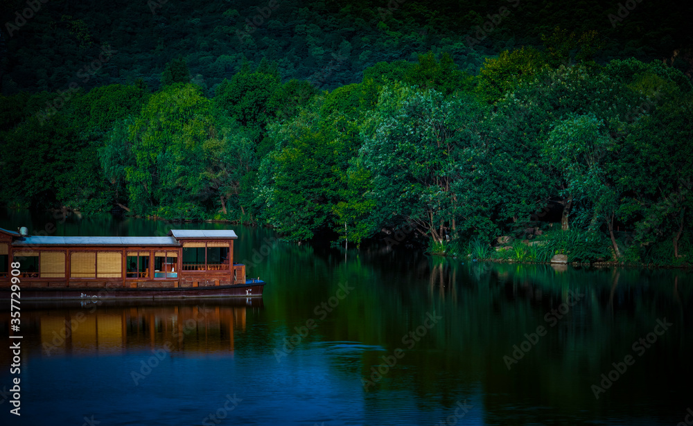 Driving on an antique boat on a calm lake Driving on an antique boat on a calm lake