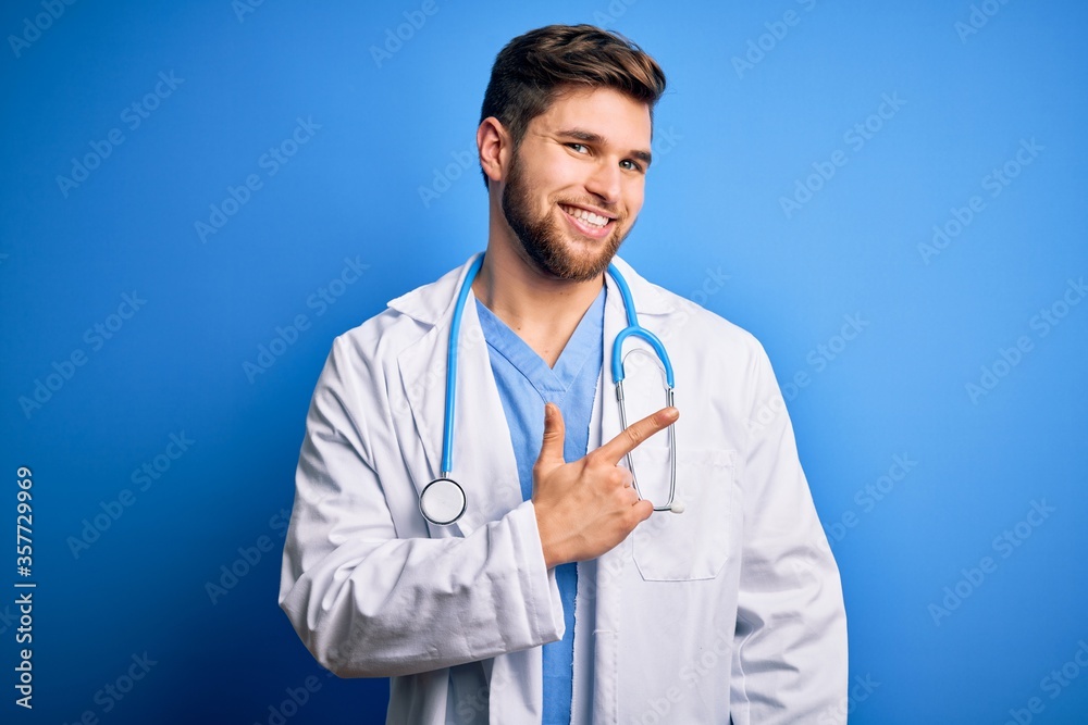 Young blond doctor man with beard and blue eyes wearing white coat and stethoscope cheerful with a smile of face pointing with hand and finger up to the side with happy and natural expression on face Young blond doctor man with beard and blue eyes wearing white coat and stethoscope cheerful with a smile of face pointing with hand and finger up to the side with happy and natural expression on face