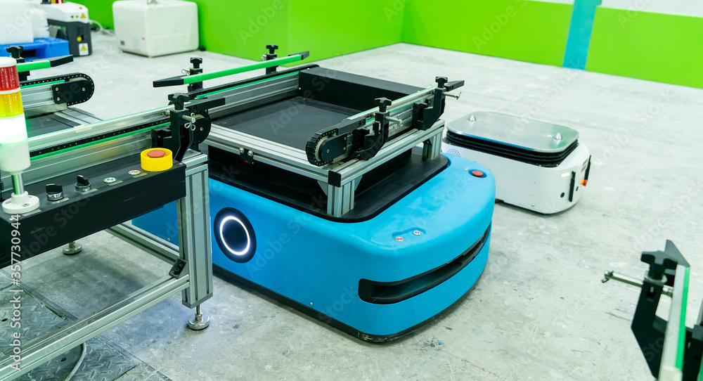 warehouse robot car carries cardboard box assembly in factory warehouse robot car carries cardboard box assembly in factory