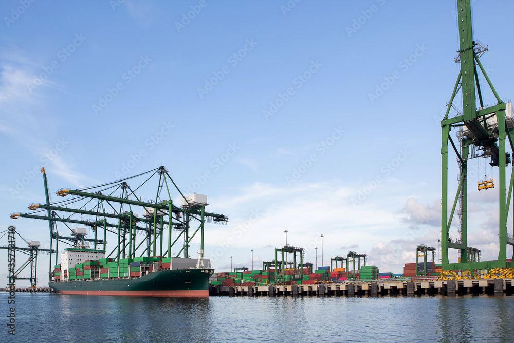 Fototapeta premium Logistics and transportation of Container Cargo ship and Cargo plane with working crane bridge in shipyard at sunny day, logistic import export and transport industry background - Image