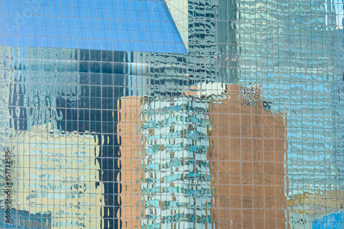 Reflection of skyscrapers on another skyscraper. The picture was taken in Dallas, TX.