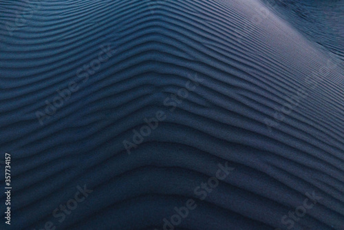 Aerial view of ripples on sand dune at dusk
