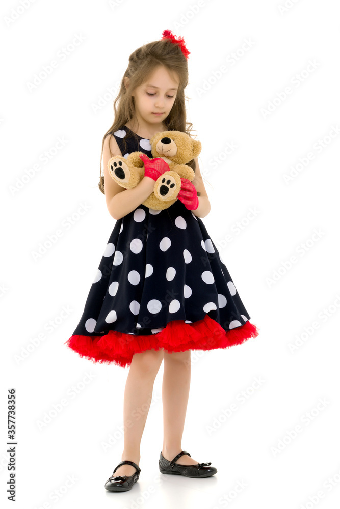 Pretty Long Haired Girl Wearing Polka Dot Dress Posing with Teddy Bear Pretty Long Haired Girl Wearing Polka Dot Dress Posing with Teddy Bear